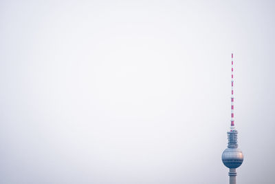 Communications tower against clear sky