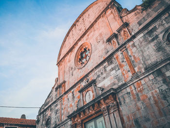 Low angle view of old building against sky