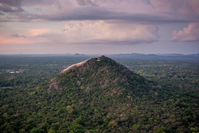 Scenic view of landscape against cloudy sky