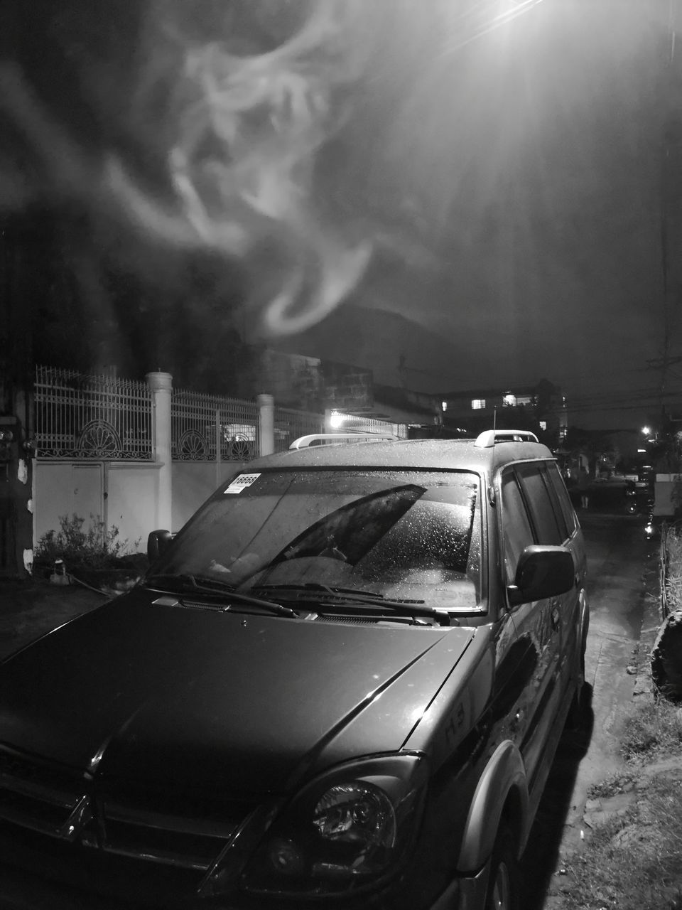 CARS ON STREET IN CITY AT NIGHT