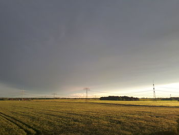 Scenic view of field against sky during sunset