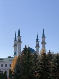 Low angle view of building against clear blue sky