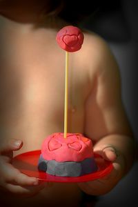 Close-up of hand holding ice cream