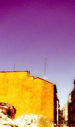 Low angle view of building against clear blue sky