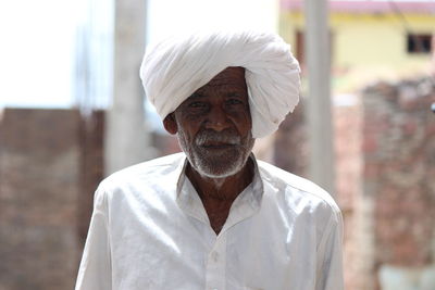 Portrait of man wearing turban while standing outdoors