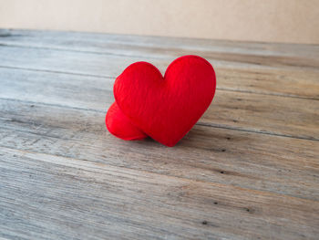 Close-up of red heart shape on table