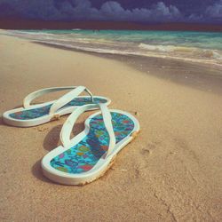 Scenic view of beach against blue sky