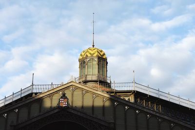 Low angle view of built structure against cloudy sky