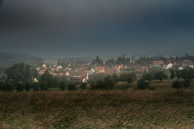 Buildings in city against sky