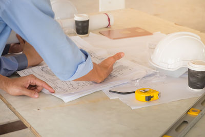 High angle view of man working on table