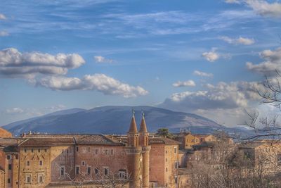 Panoramic view of buildings in city against sky