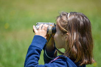 Portrait of woman photographing