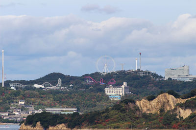 View of amusement park with buildings in background