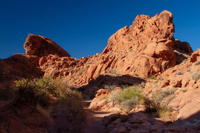 Rock formations in the orange desert landscape 