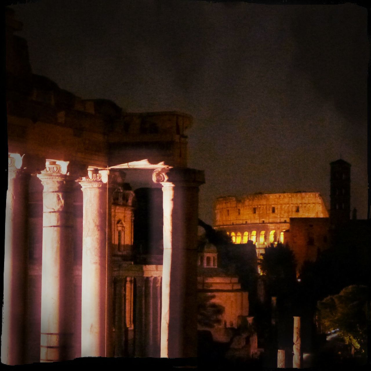 architecture, built structure, building exterior, text, low angle view, sky, history, auto post production filter, old, night, building, architectural column, western script, outdoors, exterior, illuminated, non-western script, no people, dusk, religion