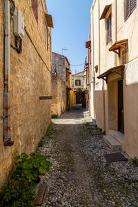 Narrow alley amidst buildings in town