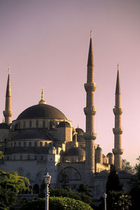 View of buildings in city against clear sky