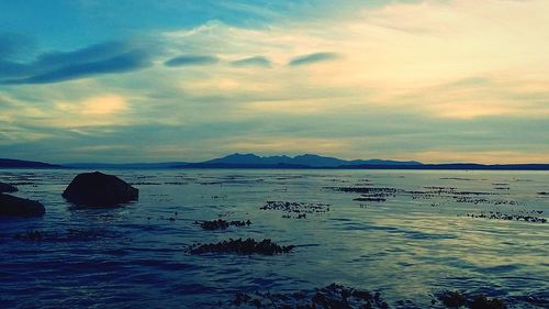 Scenic view of sea against sky at sunset