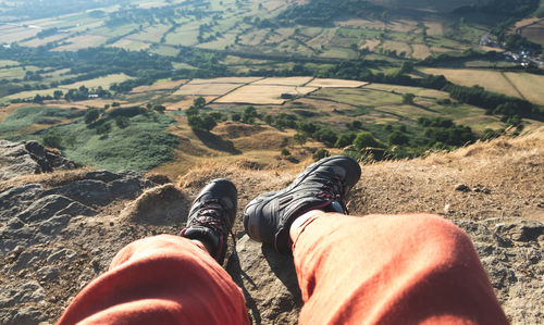 Low section of man relaxing on land