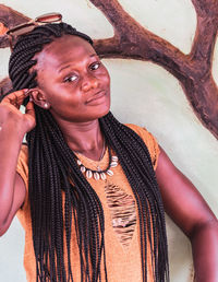 Portrait of smiling young woman standing outdoors