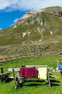 Built structure on field against mountain range