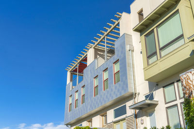 Low angle view of building against clear blue sky