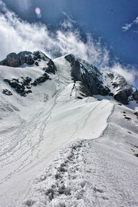 Scenic view of snowcapped mountains against sky