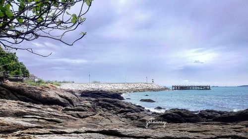 Scenic view of sea against cloudy sky