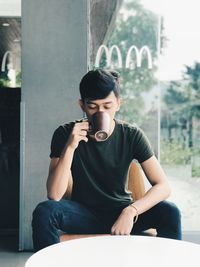 Young man smoking cigarette