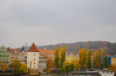 Colorful houses full of windows directed to the streets in an autumn afternoon in prague, czechia