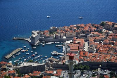 High angle view of townscape by sea