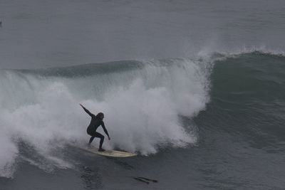 Man splashing water in sea