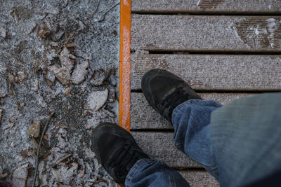 Low section of man standing outdoors