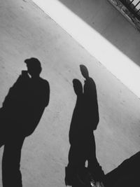 High angle view of silhouette people on shadow