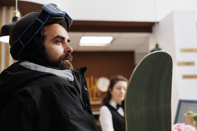 Side view of man working in gym