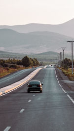 Car on road against mountain range