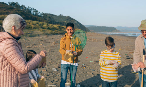 Group of volunteers preparing to clean the beach