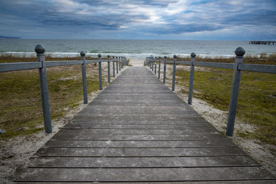 Pier over sea against sky