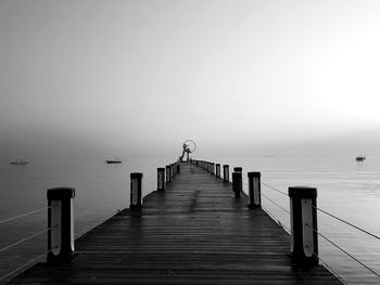 Pier over sea against clear sky