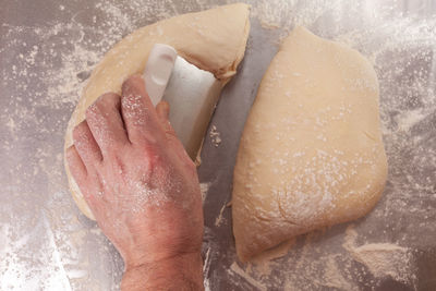 Close-up of person preparing bread dough