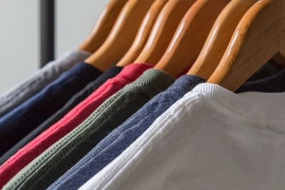 Close-up of multi colored clothes hanging on rack