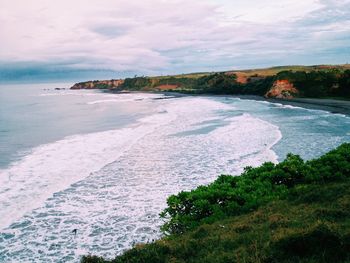 Scenic view of sea against cloudy sky