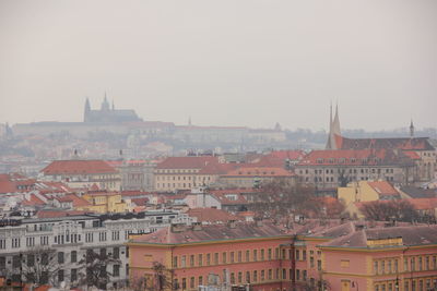 Exterior of buildings in city against clear sky