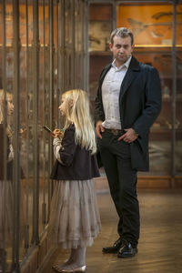 Man and girl in national museum of natural history, paris