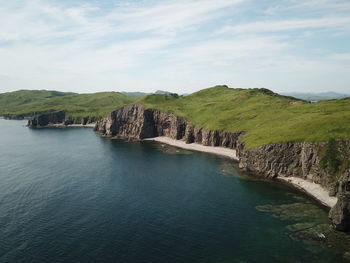 Scenic view of bay against sky