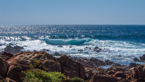 Scenic view of sea against clear sky