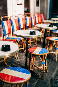 High angle view of chairs and table at sidewalk cafe