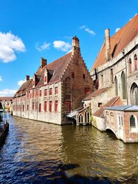 Canal amidst buildings in city