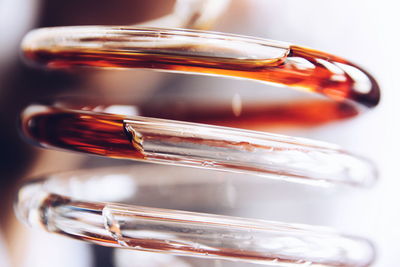 Close-up of liquid in spiral glass pipe