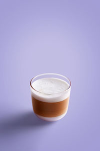 Close-up of coffee cup against black background